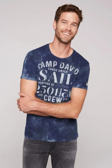 T-shirt tie-dye con grafica...